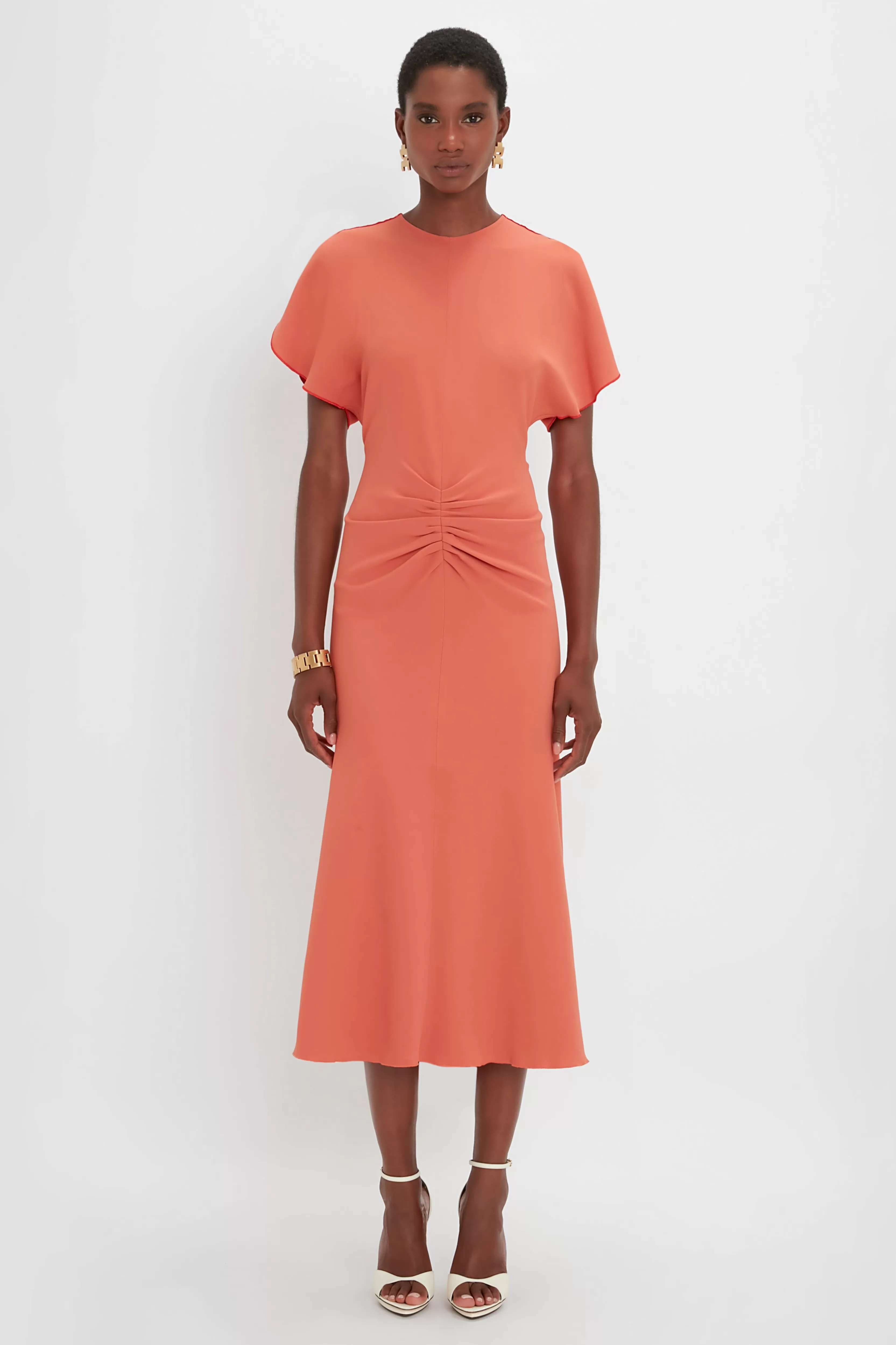 READY TO WEAR Victoria Beckham Occasionwear Edit | Pre Spring Summer 2024 | Dresses | The Gathered Waist Dress Edit | Gathered Waist Midi Dress In Papaya Orange